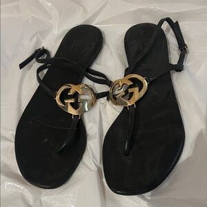 Gucci Black Sandals with Gold Emblem